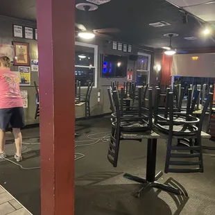 a woman in a pink shirt and black shorts