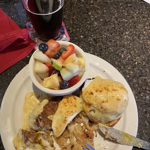 Crab cake Benedict with fruit substitution and one of the several beverages on tap.
