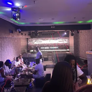 a group of people sitting around a table