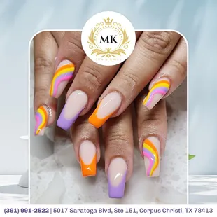 Elevate your nails with vibrant strokes of color, adding a pop of excitement and flair to your manicure for a bold and dynamic statement.