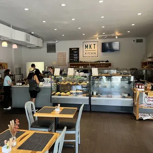 a woman standing in front of the counter