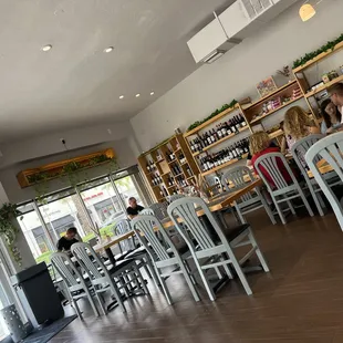 people sitting at tables in a restaurant