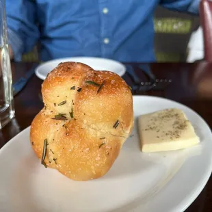 a man sitting at a table with a plate of food