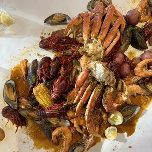 Seafood boil with crab, mussels, crawfish, shrimp, eggs, potatoes, corn and sausage.