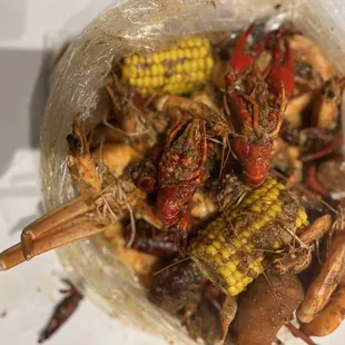 a bag of craws and corn