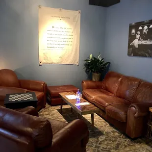 a living room with leather furniture