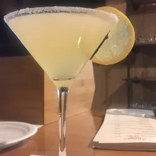 a margarita with a slice of lemon on the rim