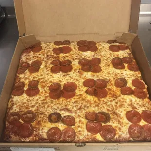 a pepperoni pizza in a box