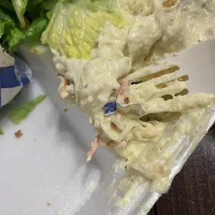 Sandwich wrapper mixed into the potato salad.