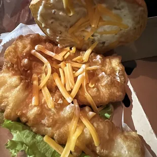a close up of a fish and chips sandwich