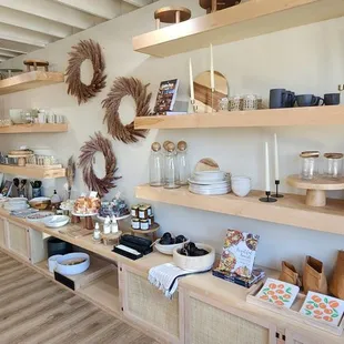 a wide selection of items displayed on wooden shelves