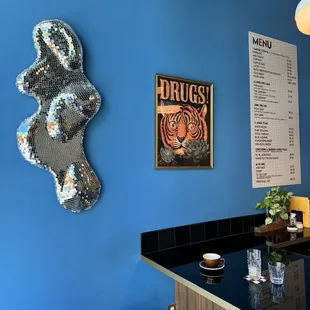 a blue wall with a menu on it