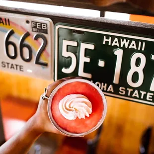  hand holding a bowl of whipped cream