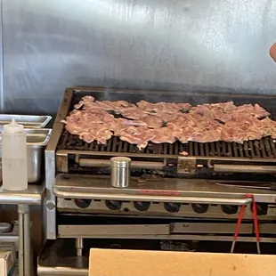 Chicken thighs on the grill.