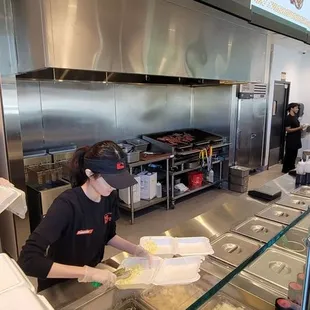  man and woman preparing food