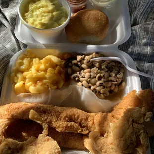 Chicken tender and fish (whiting) plate with black eyed peas, mac and cheese and potato salad