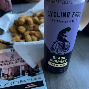 a can of cycling food and a cup of coffee
