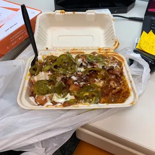 Chili cheese fries w/ fried chicken, bacon, ranch, and jalapeños.