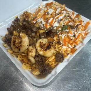 An half and half plate  Half surf n turf other half mambo