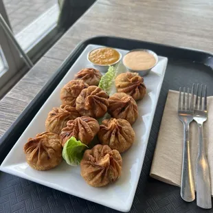 Spicy chicken fried Mo Mo with a curry sauce!