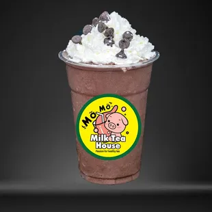 a milkshake with whipped cream and chocolate chips