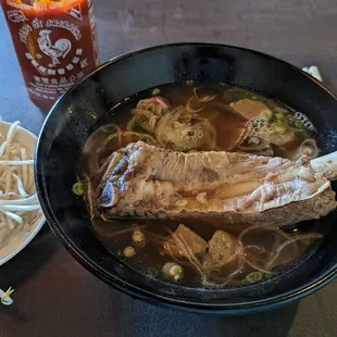 Pho dac biet with prime rib rare beef, angus brisket, meatballs, and beef short rib