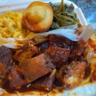 Rib tips made with homemade barbecue sauce,  with Mac and cheese, greens,  and cornbread