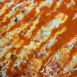 a pizza covered in sauce