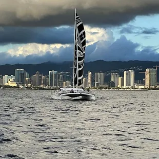 Sailing away from the rain clouds over Oahu