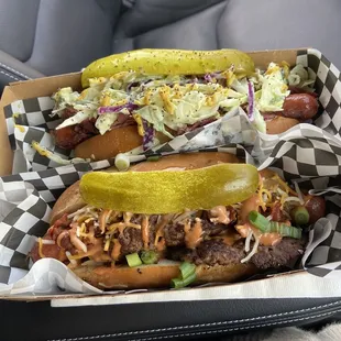 two hot dogs in a car