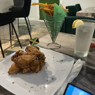 Fried wings and seasoned fries