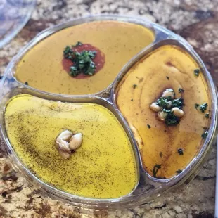 Hummus platter. Original, garlic and roasted red pepper.