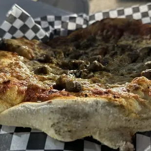 a slice of pizza in a basket