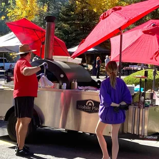 Mobile pizza oven in action