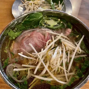 Rare Beef Pho with veggie sides.