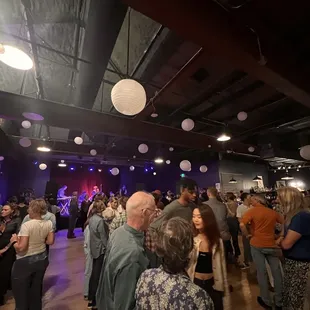 Full ballroom waiting between dances at square dancing