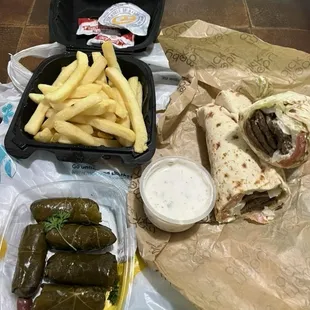 Gyro sandwich, dulmeh, and fries
