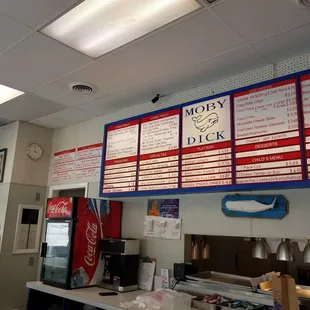 menus on the wall above the counter