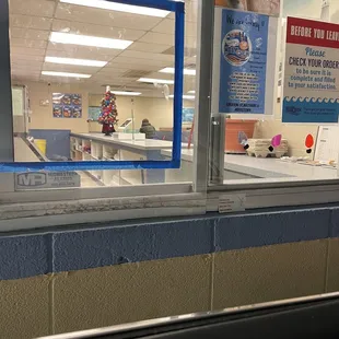 Woman mopping and handing my food! At least the unused lobby is clean. Right now the lobby is shut down you have to use the drive though.