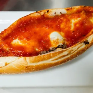 a slice of pizza on a plate