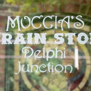 the reflection of the sign in the window