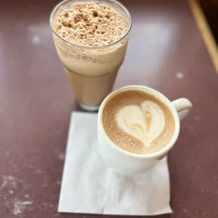 Cafe latte with foam art and large frappe with (lacking) coconut and chocolate flavorings, with oat milk