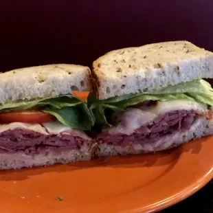 Pastrami Sandwich
 Top round pastrami, havarti cheese, spicy mustard, lettuce, tomatoes and vidalia onions.