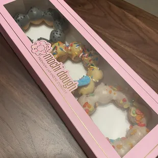 Left to right: black sesame, lychee, fruity pebble cereal mochi donut