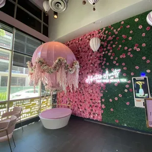 On the exterior this establishment looked closed, but I tested the door to find on the interior Beautiful decor of faux flowers.