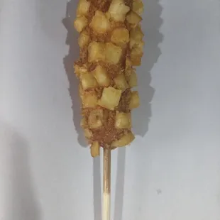 a piece of food on a stick