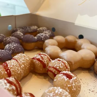 Got hungry. Ube, raspberry funnel, original glazed, and chocolate churro.