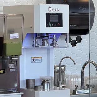 Machine to put the soda can top on the boba drink cup