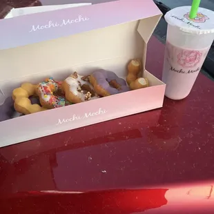 6 mochi donuts (mango x2, taro x2, hazelnut, rainbow) and Taro milk tea