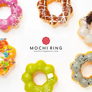 a variety of doughnuts on a white background